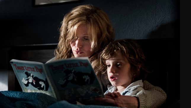 Mom reading a story to her son.