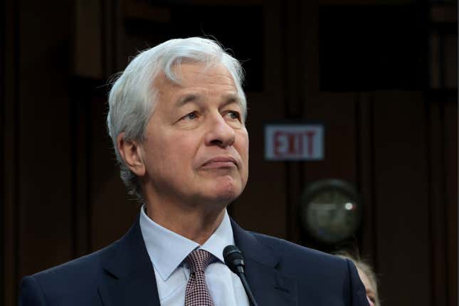 Jamie Dimon behind a small microphone