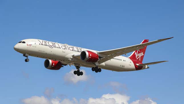 A photo of a Virgin Atlantic Boeing 787 plane landing in London. 