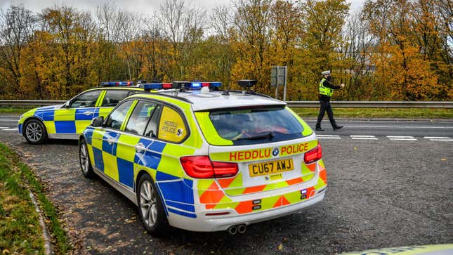 Welsh police pull over cars at a checkpoint during firebrake vehicle patrols close to the border between Carmarthenshire and Pembrokeshire, Wales.