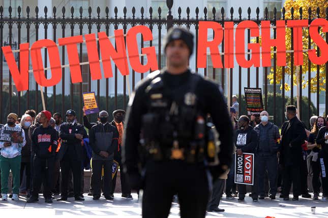 Activists take part in a voting rights protest in front of the White House November 17, 2021 in Washington, DC. Voting rights activists participated in civil disobedience to protest the “direct impact of voter suppression happening across America” and “to send a message to the White House that President Biden must take direct action to ensure the passage of voting rights legislation now.”