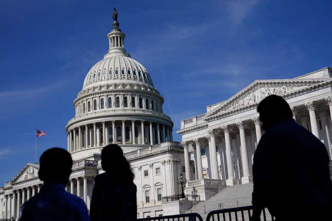 FILE - People walk outside the U.S Capitol building in Washington, June 9, 2022. President Joe Biden goes into Thursday&#39;s State of the Union address with an expanded plan to raise corporate taxes. He would use the proceeds to trim budget deficits and cut taxes for the middle class.(AP Photo/Patrick Semansky, File)