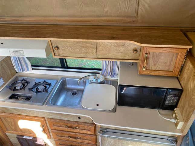 a photo of the kitchen space in the astro van