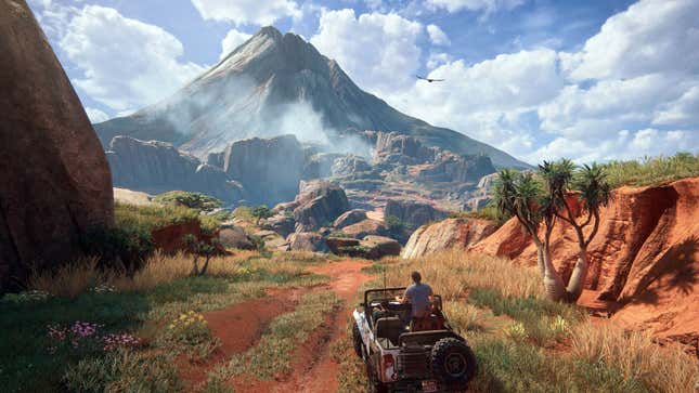 Characters driving a jeep look out at a large mountain.