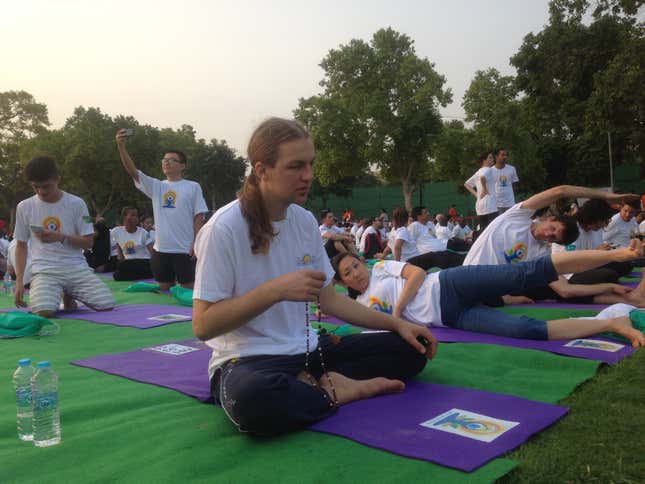 A participant warms up at the International Yoga Day celebrations in New Delhi.