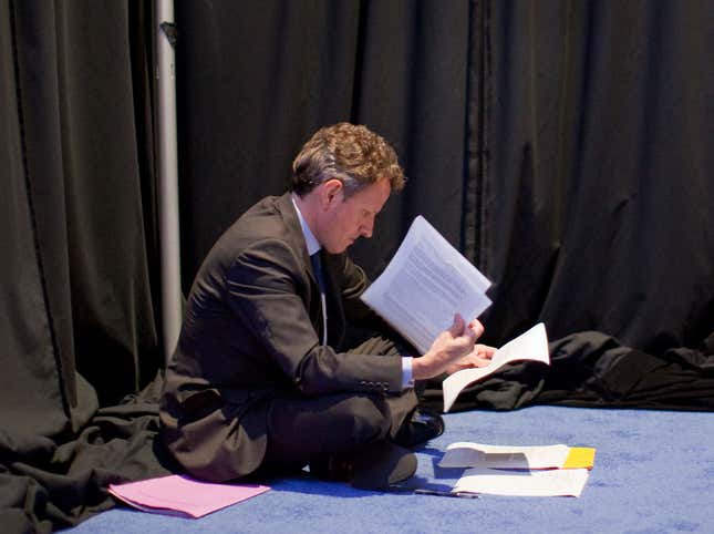 Treasury Secretary Timothy F. Geithner sits on the floor and reviews notes before President Barack Obama&#039;s press conference at the G20 Summit in Toronto, Canada.