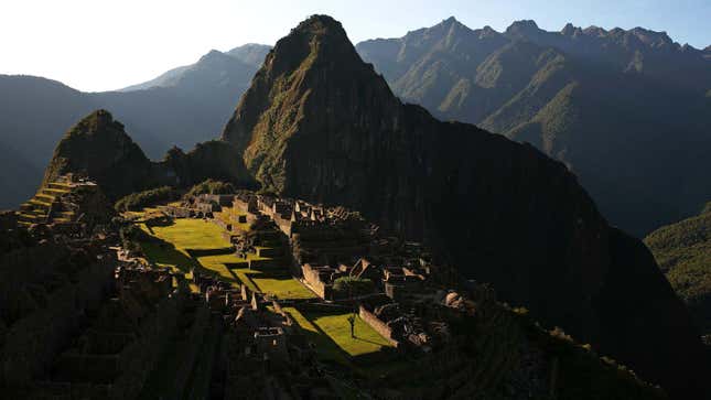A zoomed out image of Machu Picchu is shown.