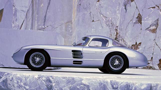 A photo of a silver Mercedes Benz 300SL sports car. 