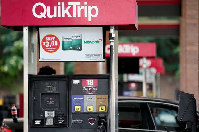 FILE - A person pumps gas on Sept. 12, 2023, in Marietta, Ga. Republican Georgia Gov. Brian Kemp on Wednesday, Nov. 8, 2023, continued his rollback of state taxes on gasoline and diesel fuel through Nov. 29, 2023, when state lawmakers will begin a special legislative session. (AP Photo/Mike Stewart, File)