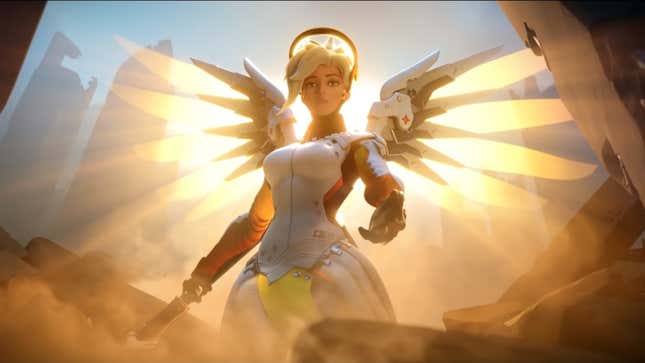 Mercy's angelic wings glow with a warm yellow light as she reaches out her hand to help a girl trapped in rubble.