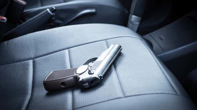 A gun on the seat of a car