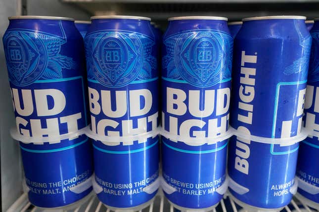 FILE-Cans of Bud Light chill in a refrigerator in Oakland, Calif., Friday, April 28, 2023. AB InBev reports earnings on Tuesday, Oct. 31. (AP Photo/Jeff Chiu)