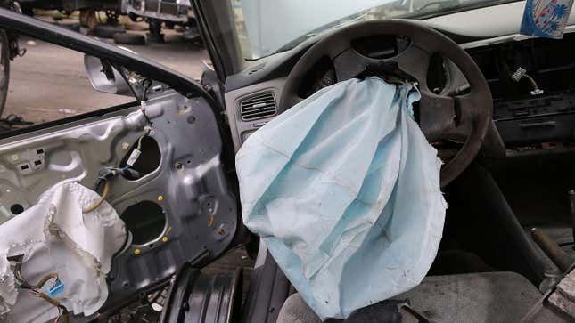 deployed airbag in a honda accord at a salvage lot