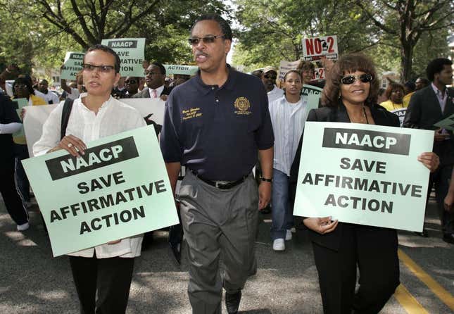 NAACP President Bruce Gordon and his wife Tawana Tibbs (L) participate in a march and rally for affirmative action on September 16, 2006, in Lansing, Michigan. The march was designed to oppose Proposal 2 on the Michigan ballot, which will be voted on November 7th. 