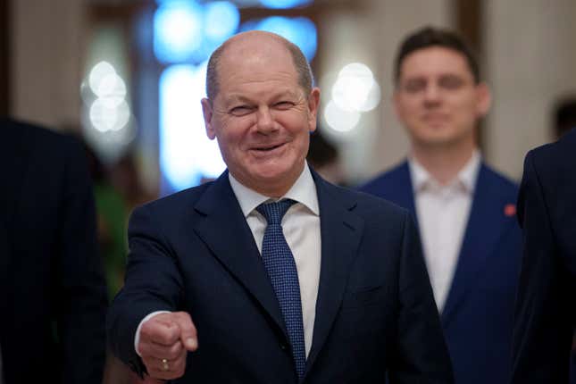 FILE - German Chancellor Olaf Scholz gestures as he arrives at the Party of European Socialists (PES) Leaders Conference, at the Palace of the Parliament, the second largest administrative building in the world after the Pentagon, in Bucharest, Romania, on April 6, 2024. Scholz arrived in China on Sunday, April 14, 2024 on a visit focused on the increasingly tense economic relationship between the sides and differences over Russia’s invasion of Ukraine. (AP Photo/Andreea Alexandru, File)