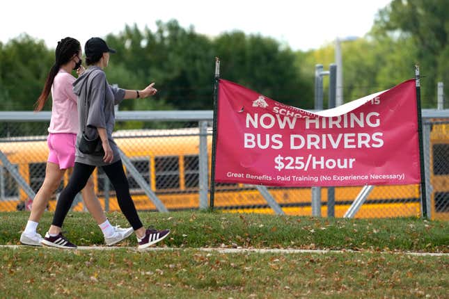 A sign advertising jobs for bus drivers is posted in Palatine, Ill., Wednesday, Sept. 13, 2023. On Thursday, the Labor Department reports on the number of people who applied for unemployment benefits last week. (AP Photo/Nam Y. Huh)