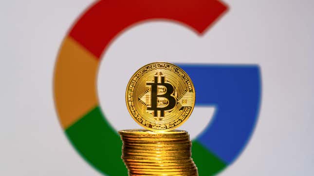 A stack of gold bitcoins sitting in front of a Google "G" symbol.