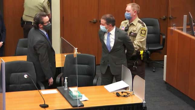 Former Minneapolis Police Officer Derek Chauvin, center, is taken into custody as his attorney, Eric Nelson, left, looks on after the verdicts were read at Chauvin’s trial for the 2020 death of George Floyd, at the Hennepin County Courthouse in Minneapolis, April 20, 2021.