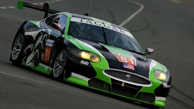 A photo of a black and green Jaguar XKR racer. 