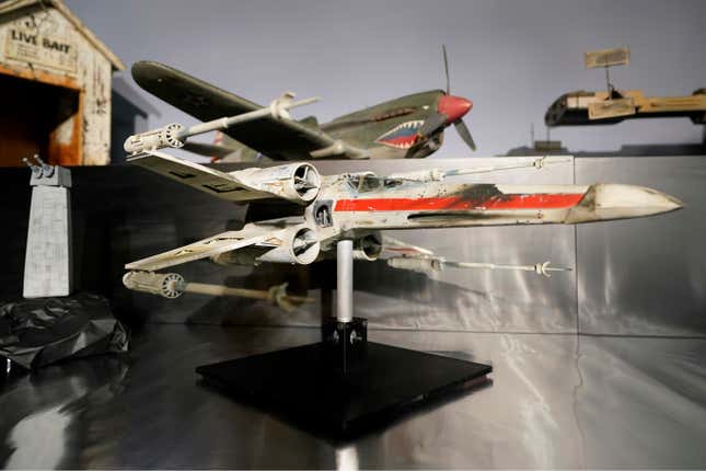 FILE - A miniature model called &quot;Red Leader,&quot; a X-wing Starfighter from the 1977 film &quot;Star War, Episode IV, A New Hope,&quot; sits on display at Heritage Auctions, Aug. 30, 2023, in Irving, Texas. The miniature X-wing Starfighter used in a “Star Wars” film sold for over $3 million on Sunday, Oct. 15, during a weekend auction of items both collected and created by longtime Hollywood model maker Greg Jein. (AP Photo/Tony Gutierrez, File)