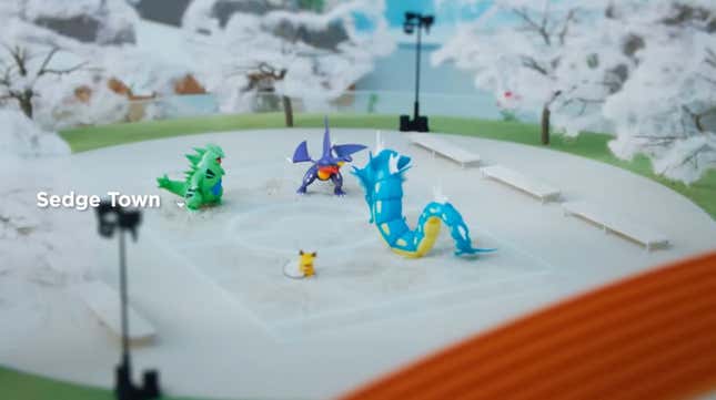 Some crappy plastic figures on a tabletop.
