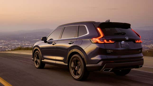 A photo of a blue 2023 Honda CR-V at sunset. 