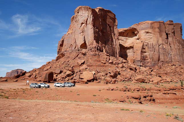 View of sandstone buttes under a blue cloudy sky on September 27, 2022 in Monument Valley, Arizona.