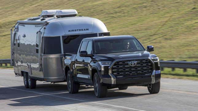 A black Toyota Tundra towing an Airstream