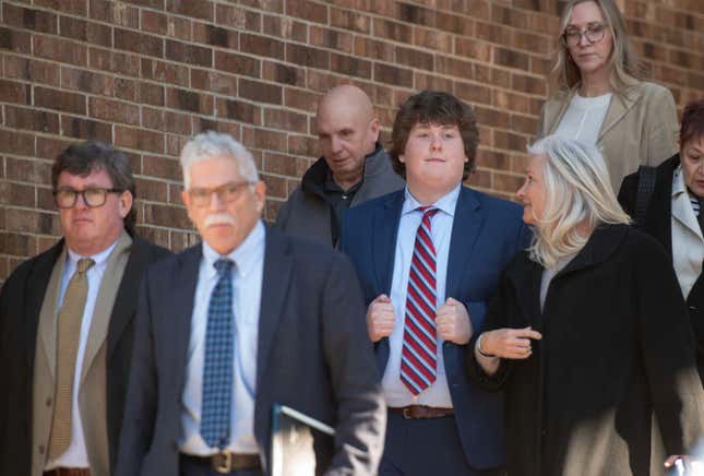 John Sheeran, 15,center, leaves Barnstable District Court after his sentencing hearing surrounded by family members. Photo on February 5, 2025.