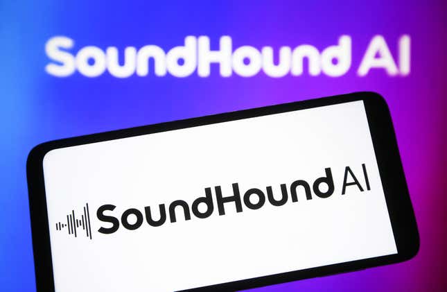 SoundHound AI logo is seen on a smartphone and on a pc screen