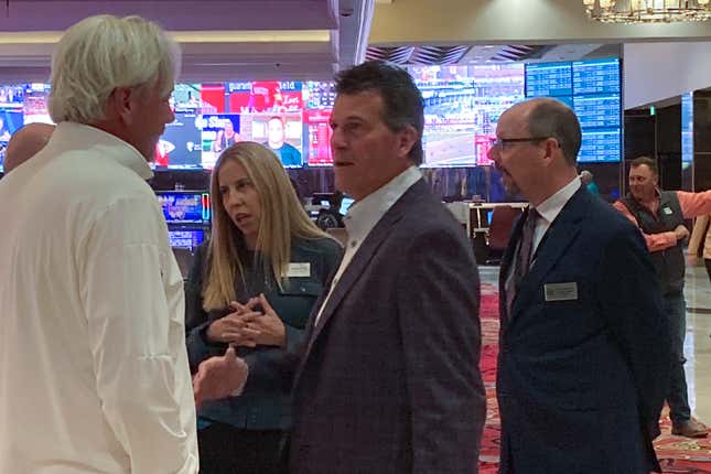 Nevada basketball coach Steve Alford, center, talks to wolf pack backers on the floor of the grand Sierra resort hotel casino ahead of a news conference Wednesday, Sept. 27, 2023 in Reno, Nev. The University of Nevada’s basketball team could have a new off-campus home by 2026 under an ambitious 10-year expansion plan that Reno’s largest hotel-casino announced Wednesday. The nearly $1 billion private capital investment will be the biggest in the city&#39;s history, according to officials of the Grand Sierra Resort. (AP Photo/Scott Sonner)