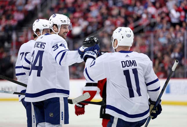 NEWARK, NEW JERSEY - APRIL 09: Auston Matthews #34 of the Toronto Maple Leafs celebrates his goal with teammate Max Domi #11 of the Toronto Maple Leafs during the third period against the New Jersey Devils at Prudential Center on April 09, 2024 in Newark, New Jersey. The Toronto Maple Leafs defeated the New Jersey Devils 5-2. (Photo by Elsa/Getty Images)