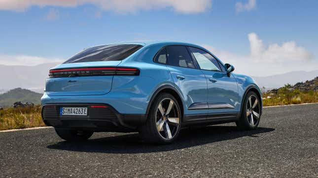 Rear 3/4 view of a blue Porsche Macan Electric