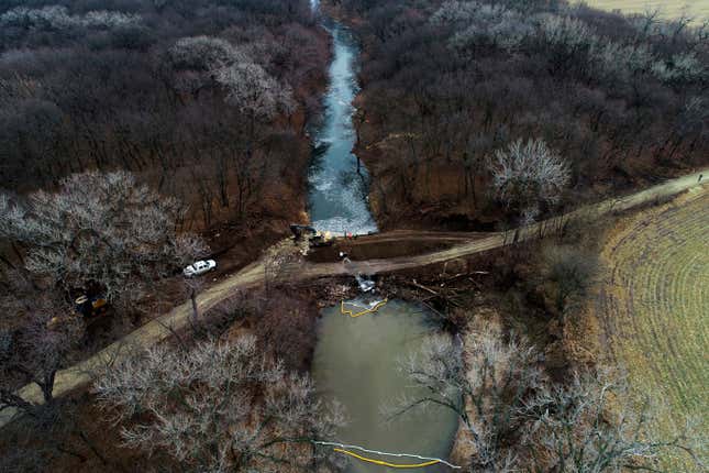 FILE - In this photo taken by a drone, cleanup continues in the area where the ruptured Keystone pipeline dumped oil into a creek in Washington County, Kan., Dec. 9, 2022. TC Energy, the operator of the Keystone pipline system, has finished cleaning up a massive December 2022 oil spill, and the creek affected by it is flowing naturally again, the company and the U.S. Environmental Protection Agency announced Tuesday, Oct. 31, 2023. (DroneBase via AP, File)