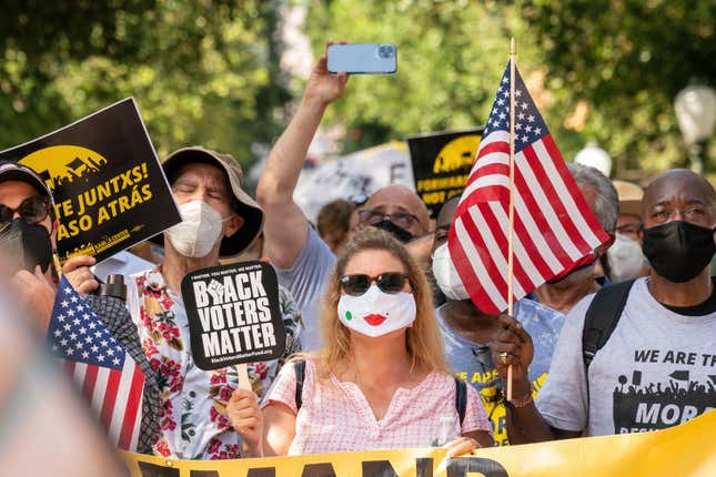 People march during a rally to support voting rights at the Texas State Capitol on July 31, 2021, in Austin, Texas. 