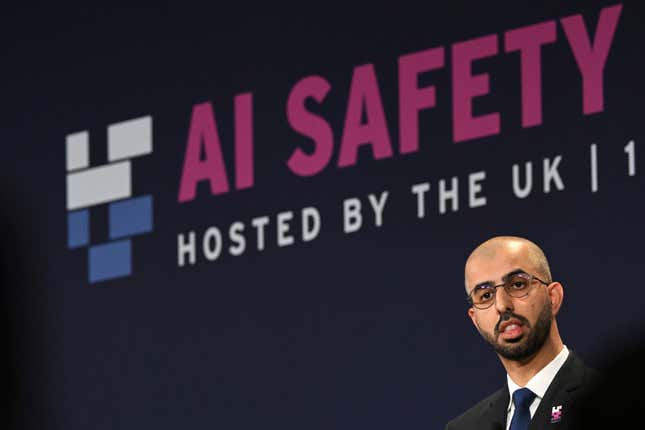 AI Safety Summit logo on a navy backdrop behind Omar Sultan Al Olama