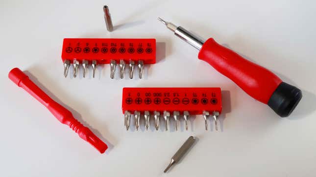 A photo of a screwdriver set with a range of different bit options. 