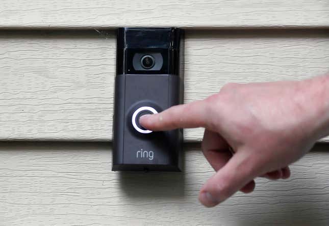 FILE - A person pushes the doorbell on his Ring doorbell camera, July 16, 2019, at his home in Wolcott, Conn. The Federal Trade Commission is sending $5.6 million in refunds to consumers as part of a settlement with Amazon-owned Ring, which was charged with failing to protect private video footage from outside access. (AP Photo/Jessica Hill, File)