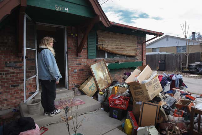 A woman in front of rental home.