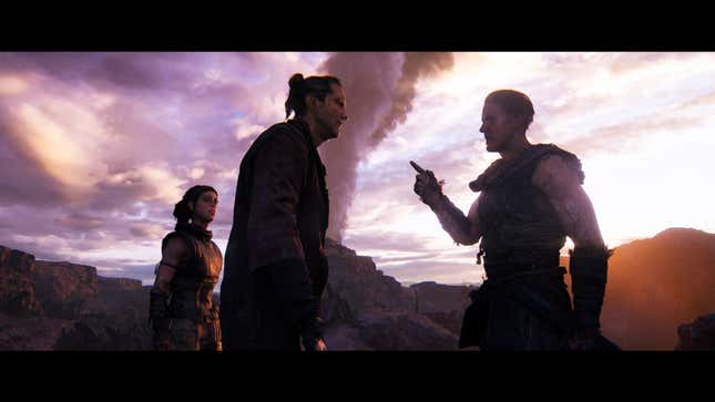 Two characters talk in front of Senua.