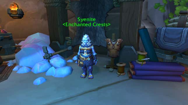 A dwarf stands next to an armor chest piece.