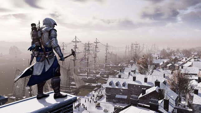 A man in a white hood carries and axe and stands on a snowy roof. 