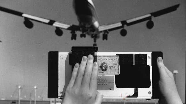 A 1994 photo of an airplane and a credit card charge machine