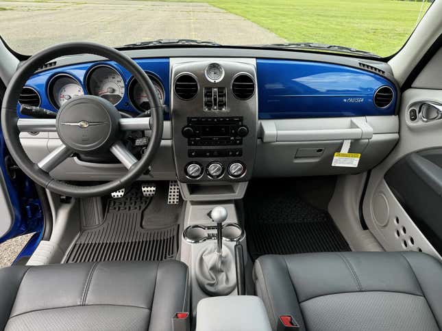 A photo of the forward cabin of a blue PT cruiser