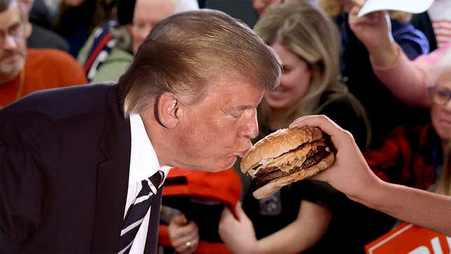 Image for article titled Trump Kisses Supporter’s Burger