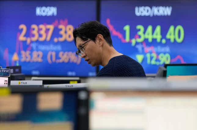 A currency trader watches monitors at the foreign exchange dealing room of the KEB Hana Bank headquarters in Seoul, South Korea, Thursday, Nov. 2, 2023. Asian shares were mostly higher Thursday after the U.S. Federal Reserve indicated it may not need to pump the brakes any harder on Wall Street and the economy. (AP Photo/Ahn Young-joon)