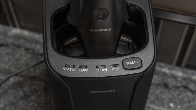 The Arc6 razor inserted into its charging and cleaning dock.