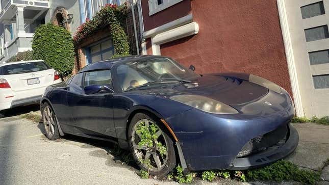 Image for article titled Dear Readers, Find The Weed-Ridden Tesla Roadster In San Francisco And We’ll Send You A Hat