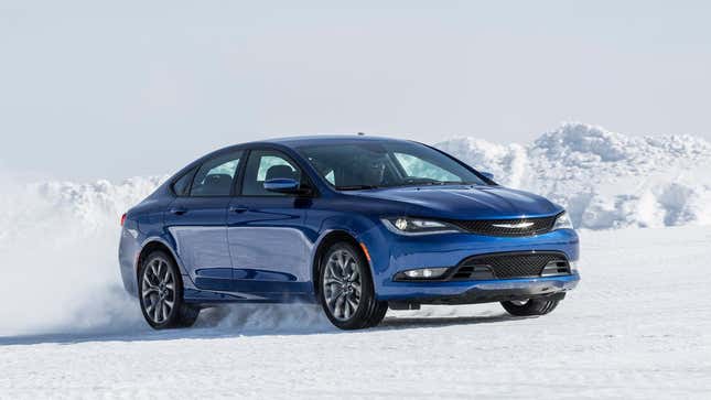 A blue Chrysler 200 driving through the snow