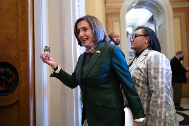 Former House Speaker Nancy Pelosi, D-Calif., displays her voting card as she arrives at the chamber where members approved a 45-day funding bill to keep federal agencies open, but the measure must first go to the Senate, at the Capitol in Washington, Saturday, Sept. 30, 2023. House passage came after Speaker Kevin McCarthy dropped plans for steep spending cuts and relied on Democratic help. (AP Photo/J. Scott Applewhite)